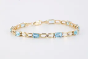 7" 14k Yellow Gold 4.50tcw Topaz 0.04tcw Diamond Bracelet (6.10g.)